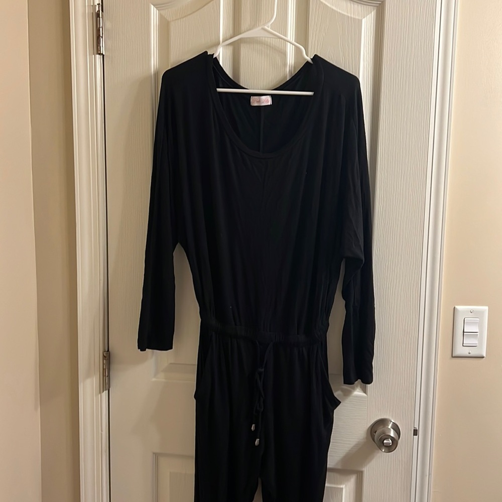 Large pink Lily black long sleeve jumpsuit. With pockets. Soft material.